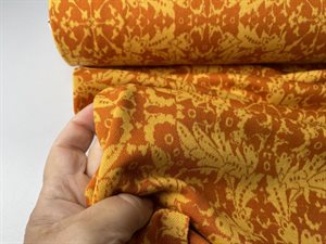 Jacquard strik - flot blomsterinspireret motiv i gul og orange